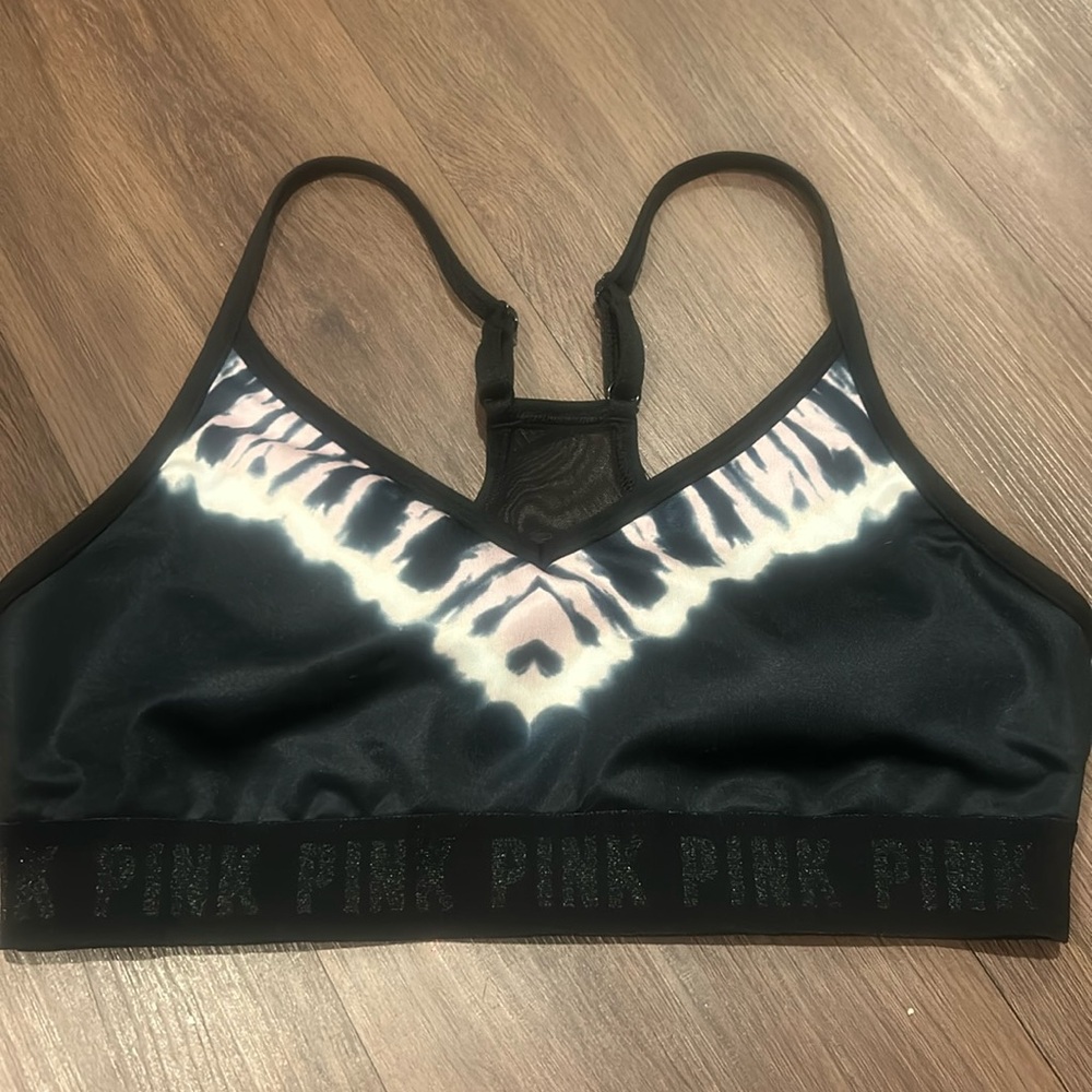Pink bra in size medium. the dye design with pads. the elastic had “pink” on it.